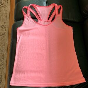 A strappy back tank top. Size medium. Never worn. Great condition.